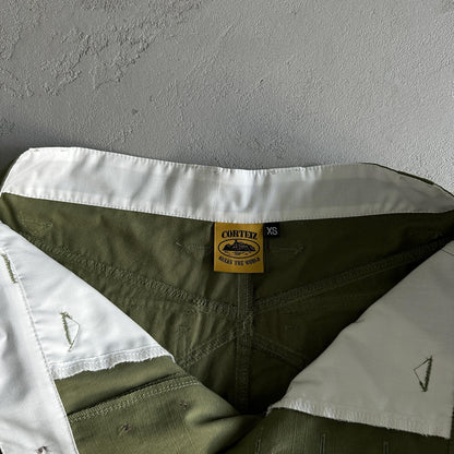 Pantaloncini Corteiz con tasca obliqua