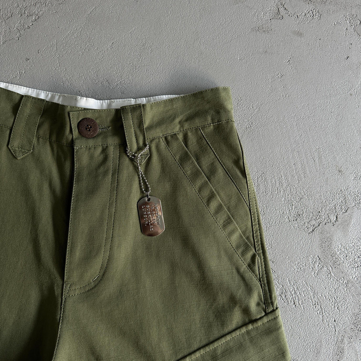 Pantaloncini Corteiz con tasca obliqua