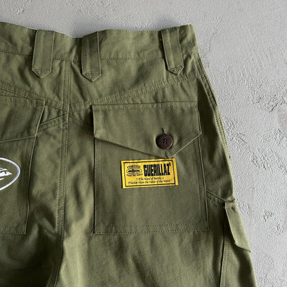 Pantaloncini Corteiz con tasca obliqua