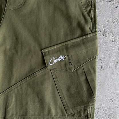 Pantaloncini Corteiz con tasca obliqua