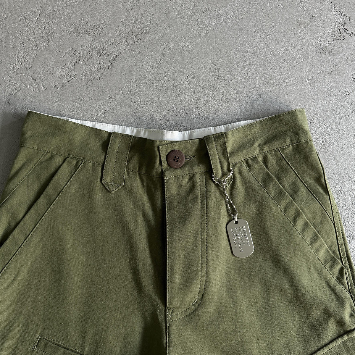 Pantaloncini Corteiz con tasca obliqua